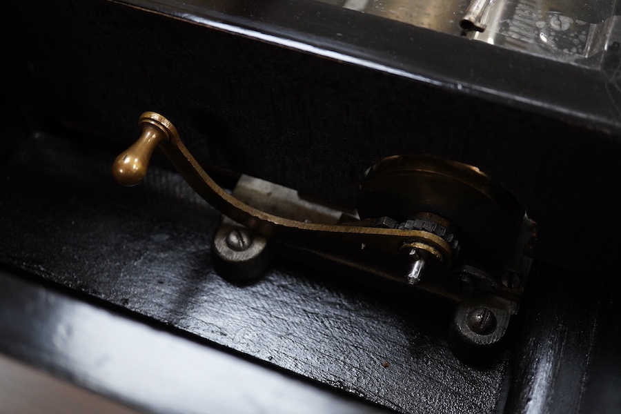 A 19th century Swiss cylinder music box, in a walnut and kingwood cross banded case, with 43 tooth cylinder (missing one tooth), and three bells with butterfly hammers, playing eight airs, cylinder 15.5cm long, case 48cm